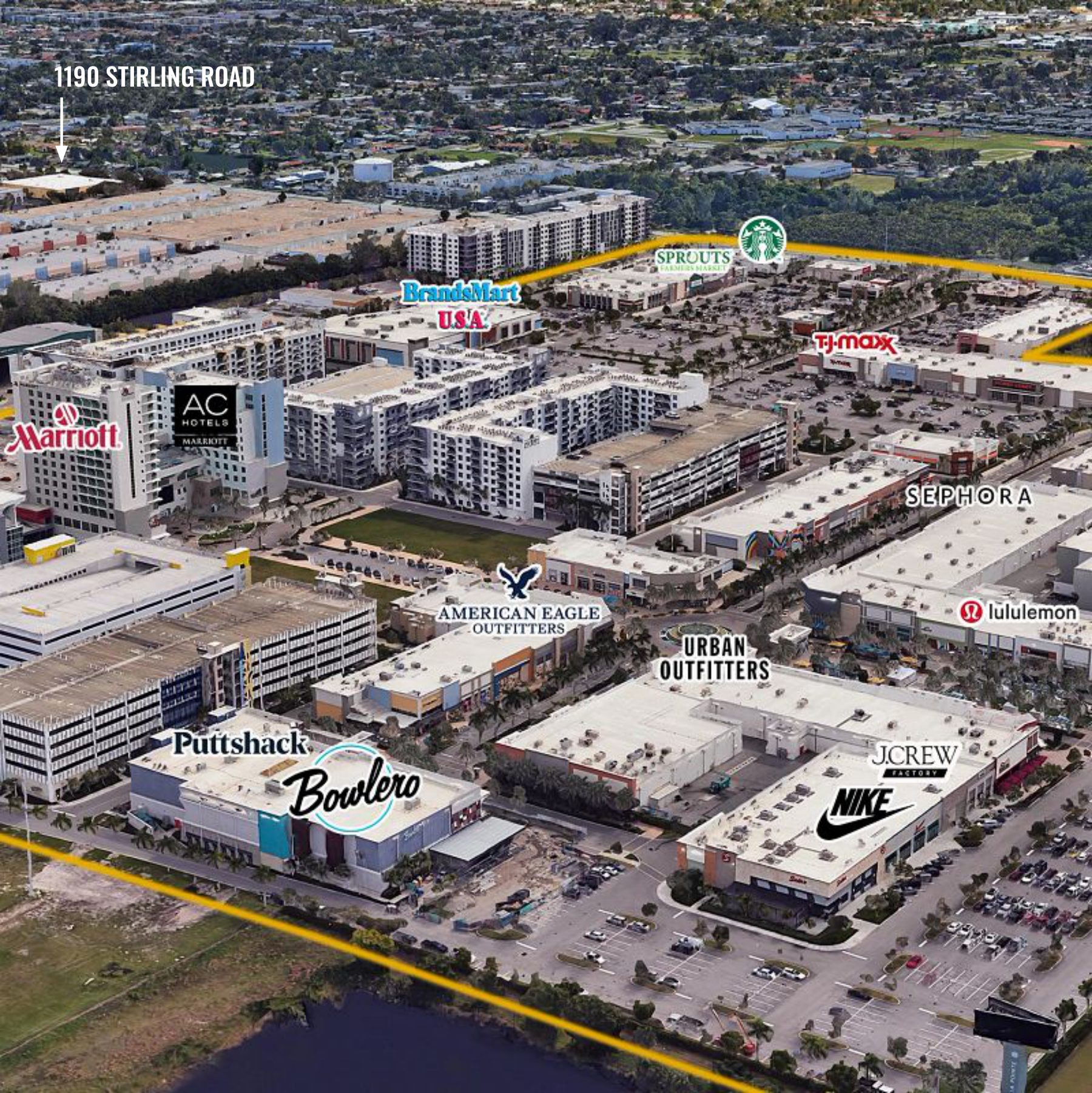 Aerial view of Dania Pointe with retailers including Nike, Sephora, T.J. Maxx, Sprouts, American Eagle, Urban Outfitters and Bowlero, and an arrow marking 1190 Stirling Road